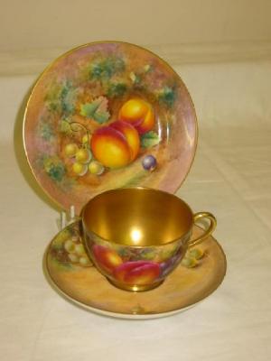 Appraisal: A ROYAL WORCESTER PORCELAIN TRIO painted with peaches and grapes