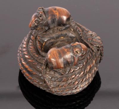 Appraisal: A Japanese carved wooden netsuke Meiji period modelled as two