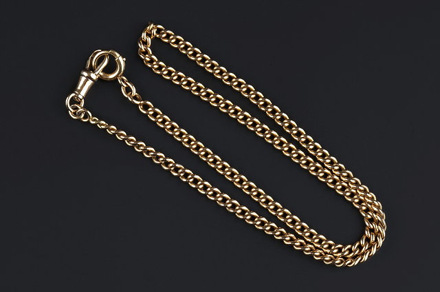 Appraisal: A YELLOW METAL ALBERT CHAIN composed of uniform curb-links with