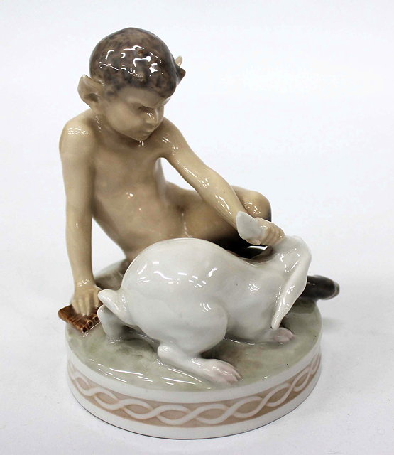 Appraisal: A ROYAL COPENHAGEN PORCELAIN MODEL of a seated fawn with