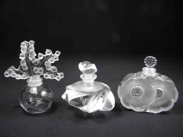 Appraisal: Three Lalique French crystal perfume bottles with stoppers Includes ''Samoa''