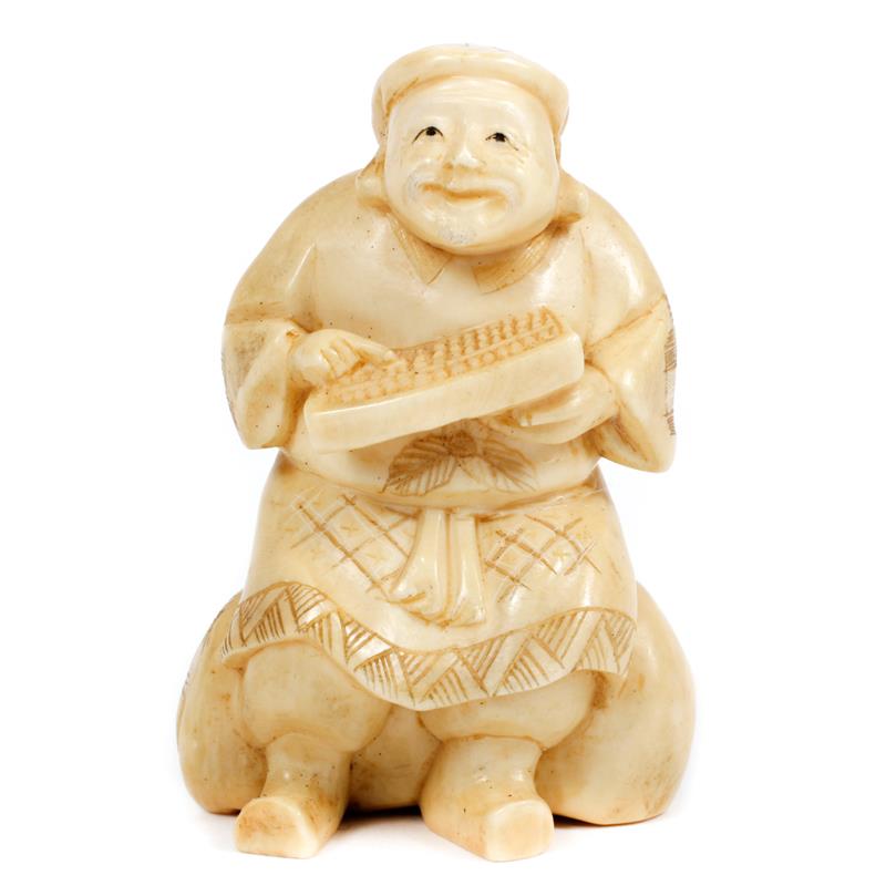 Appraisal: Japanese carved ivory netsuke figure of man with abacus marked