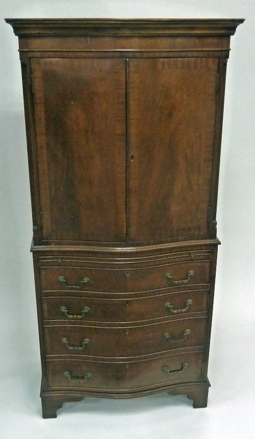 Appraisal: A mahogany pedestal desk fitted a surround of nine drawers