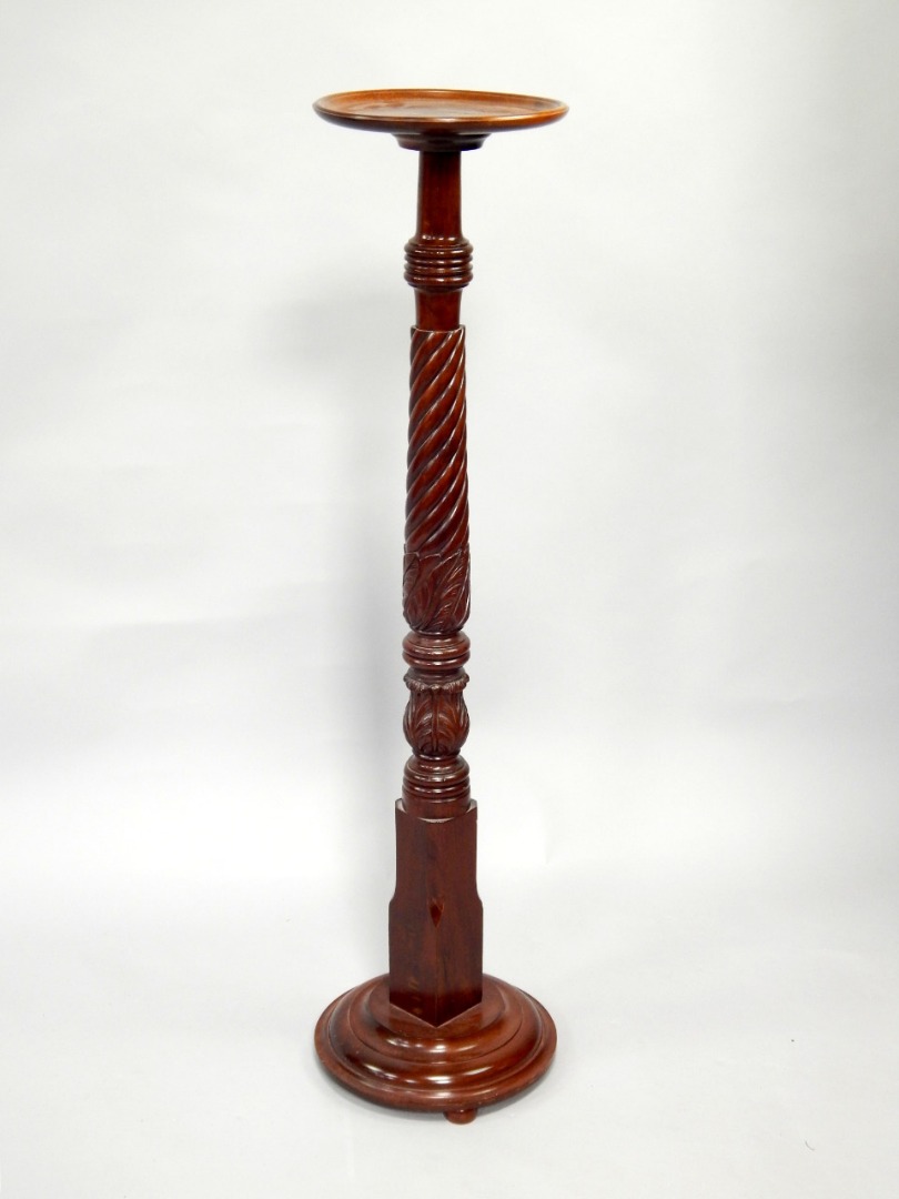 Appraisal: A mahogany torchere with circular dish and moulded platform top