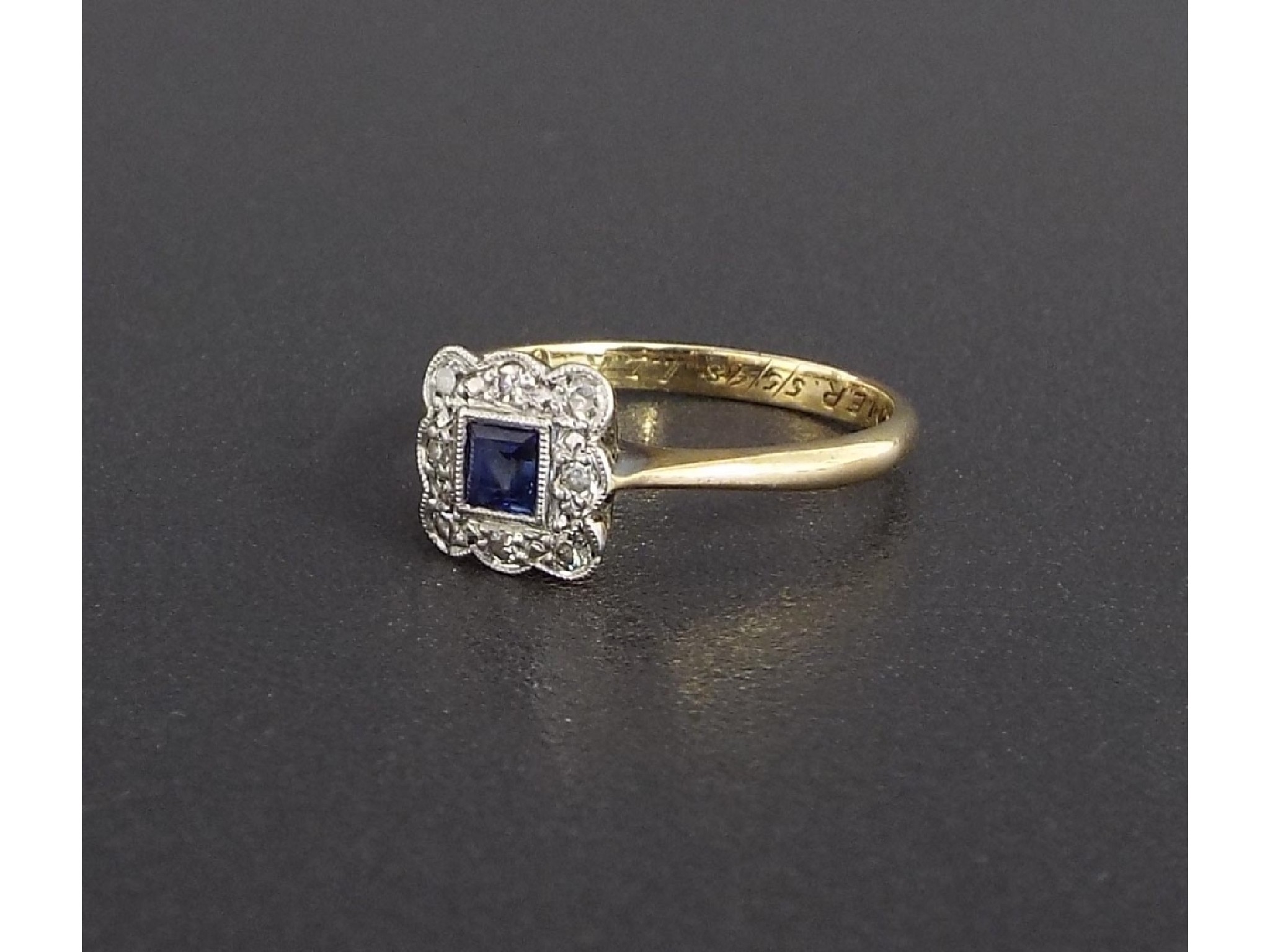 Appraisal: Platinum and ct sapphire and diamond square cluster ring the