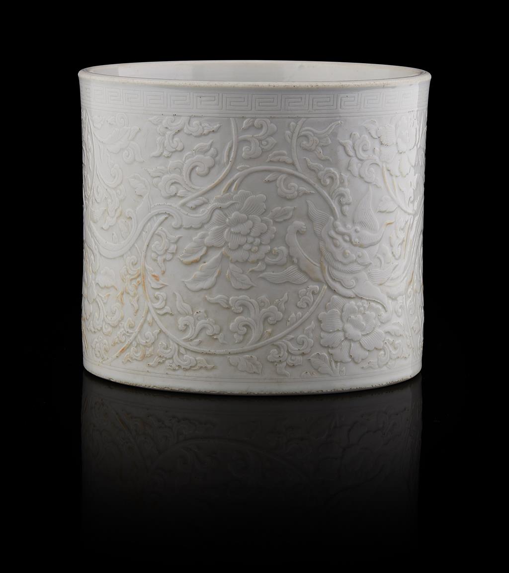 Appraisal: WHITE GLAZED 'PEONY' BRUSH POT BITONG QING DYNASTY TH CENTURY