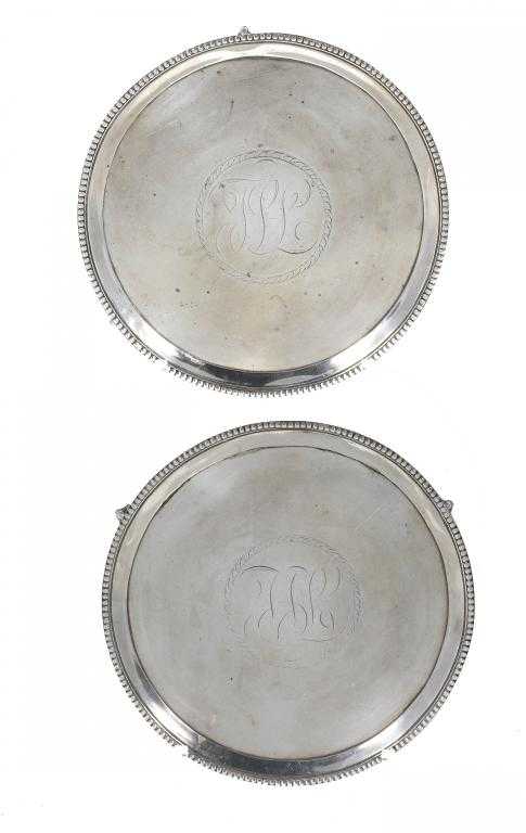 Appraisal: A PAIR OF GEORGE III WAITERS bright cut with contemporary