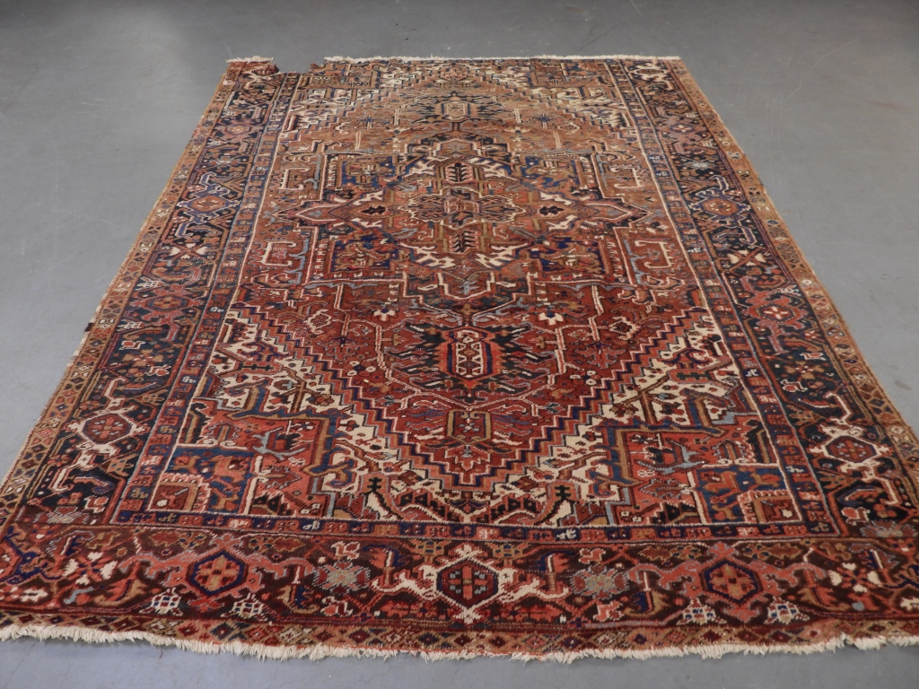 Appraisal: PERSIAN HERIZ CARPET RUG Persia th CenturyGeometric rust red center