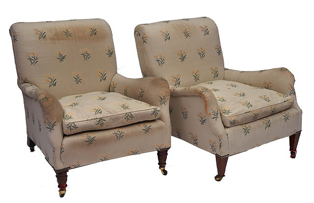 Appraisal: TWO HOWARD STYLE ARMCHAIRS on turned mahogany forelegs with ceramic