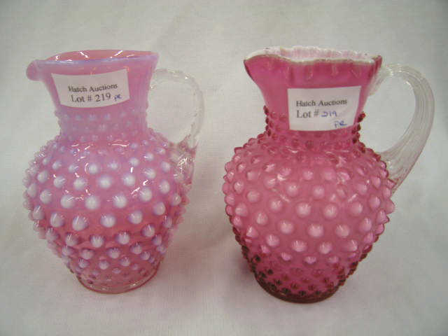 Appraisal: Cranberry Hobnail Art Glass Pitchers cased opalescent