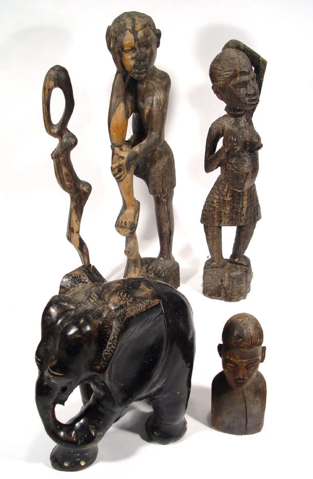 Appraisal: Five carved ethnic carved hardwood and ebony figures including an