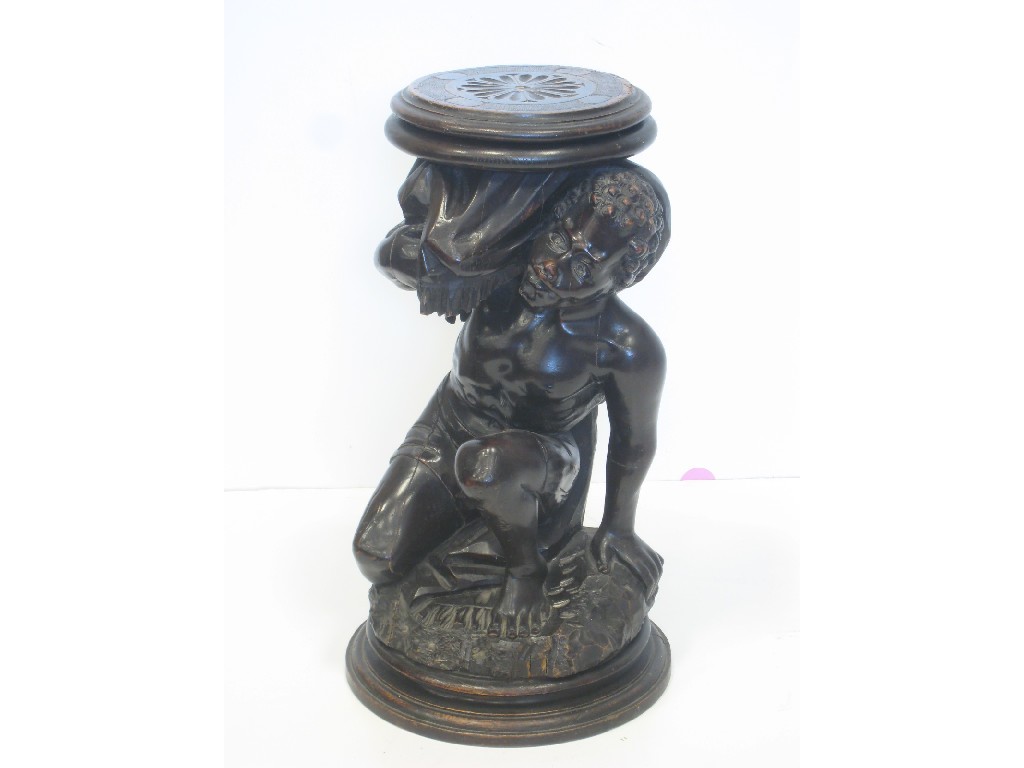 Appraisal: A th Century carved wood Blackamoor Crouching Figure ft in