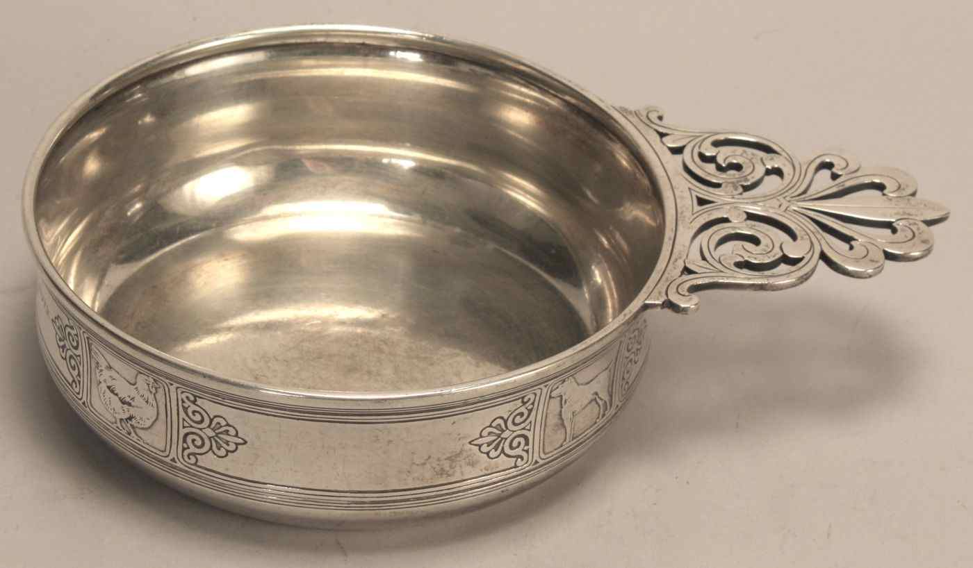 Appraisal: TIFFANY STERLING SILVER PORRINGER Decorated with dog cat goose and