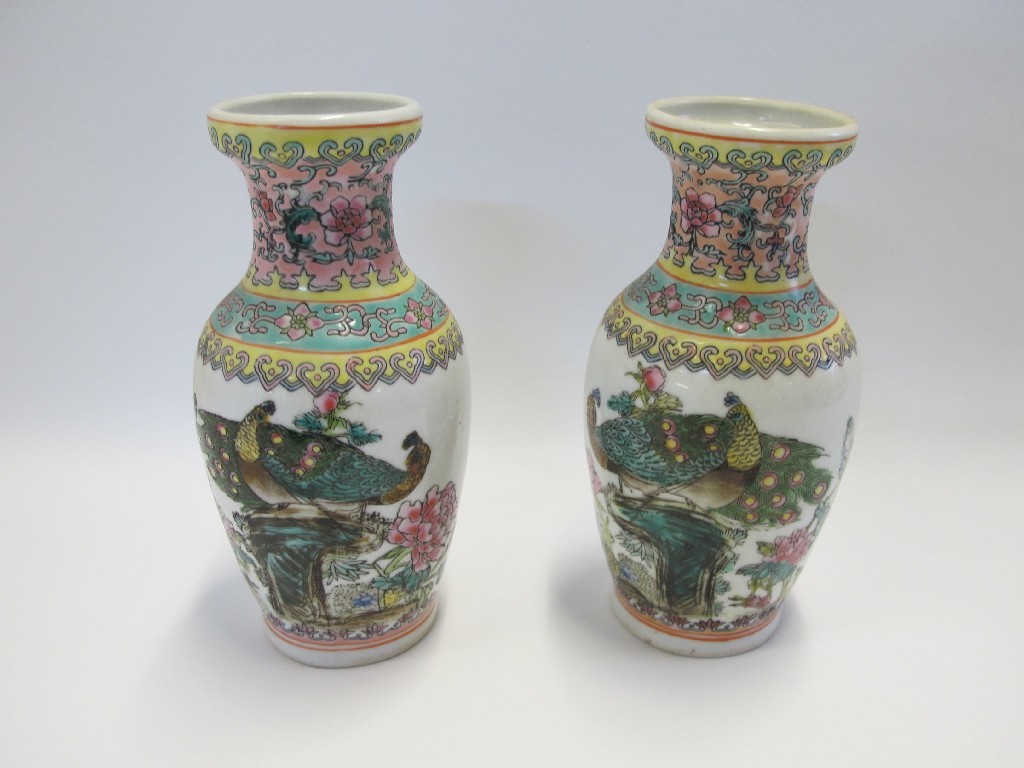 Appraisal: Pair of Chinese vases each decorated with a pair of