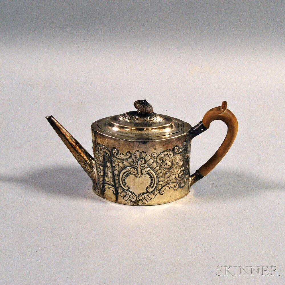 Appraisal: George III Sterling Silver Repousse Teapot London maker's mark for