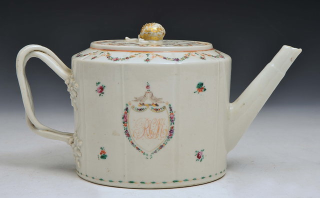 Appraisal: A CHINESE CYLINDRICAL ARMORIAL TEAPOT with famille rose swags and