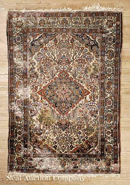 Appraisal: An Antique Persian Rug camel and red ground center medallion