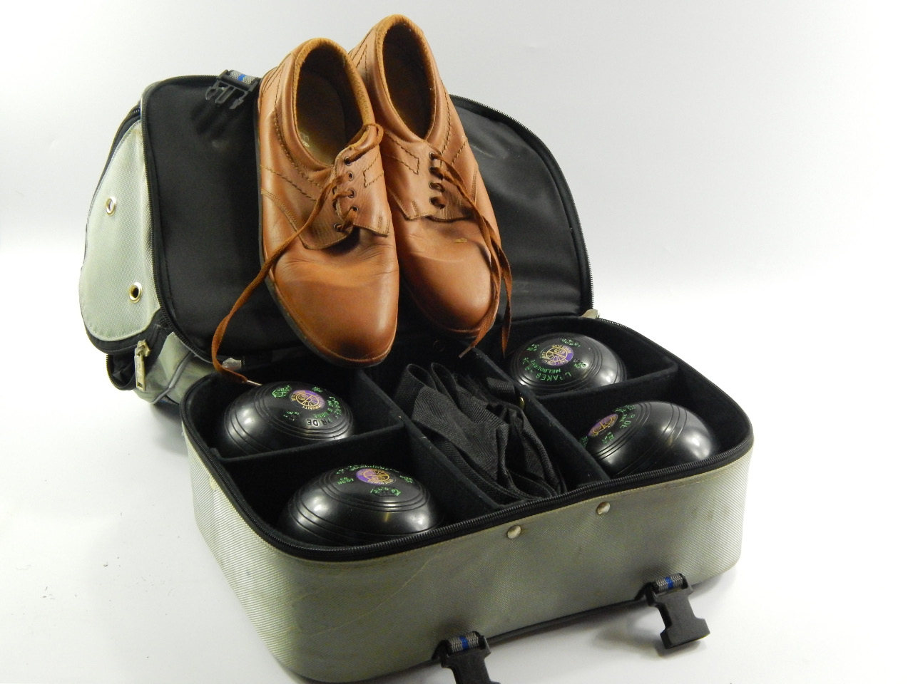 Appraisal: A set of Drakes Pride green bowls Melbourne with shoes