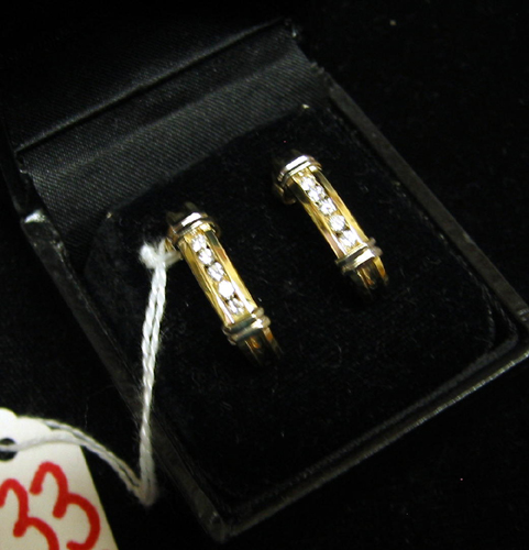 Appraisal: DIAMOND AND FOURTEEN KARAT YELLOW AND WHITE GOLD EARRINGS each