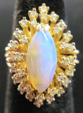 Appraisal: karat yellow gold diamond and opal cluster ring Navette form