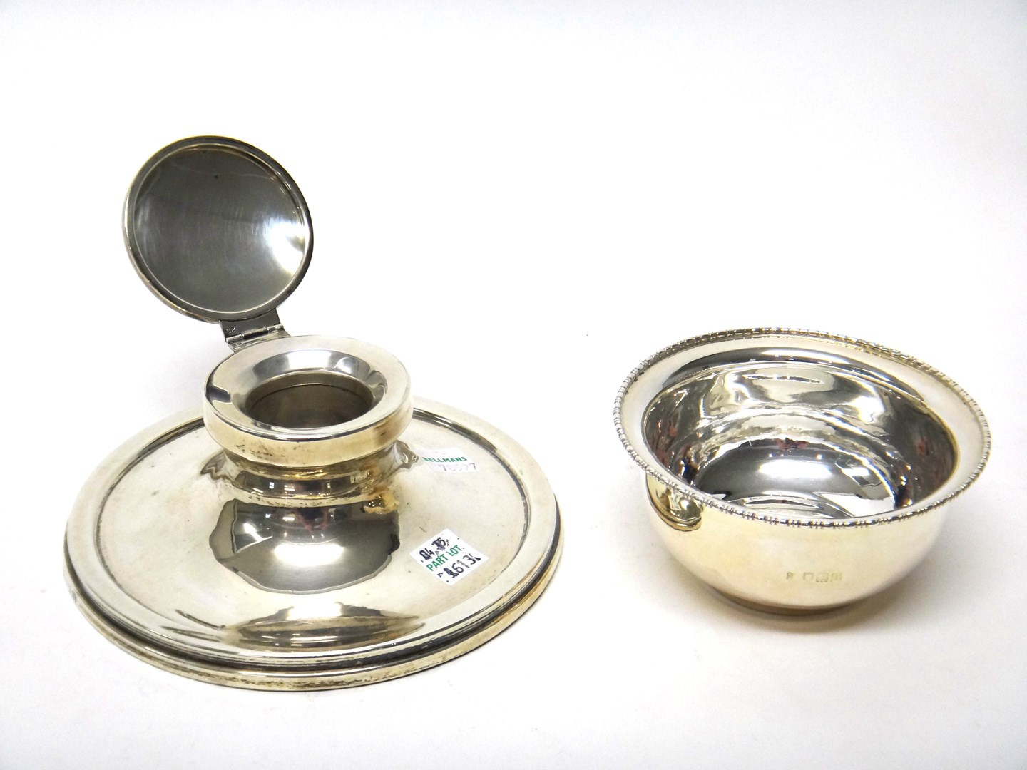 Appraisal: A silver mounted circular capstan shaped hinge lidded inkstand Birmingham