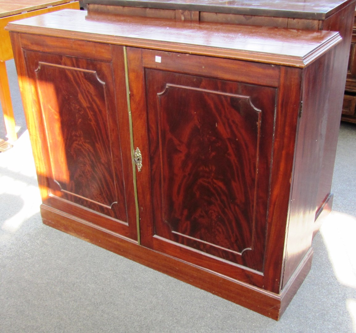 Appraisal: A th century mahogany side cabinet of rectangular form with