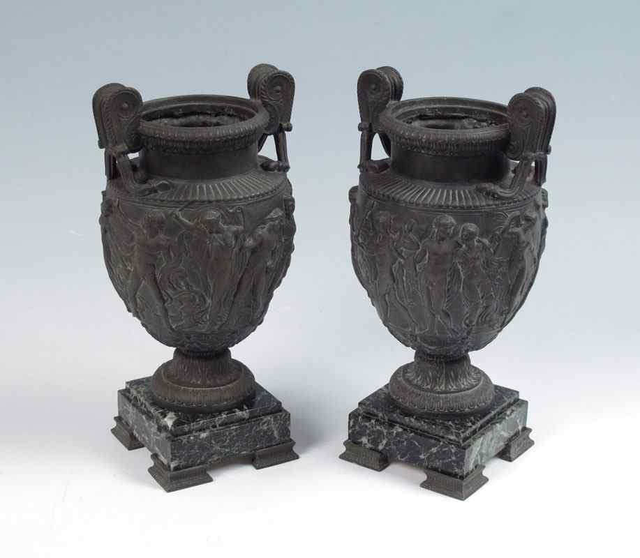 Appraisal: PAIR NEOCLASSICAL STYLE METAL URNS Cast metal urns with Greek