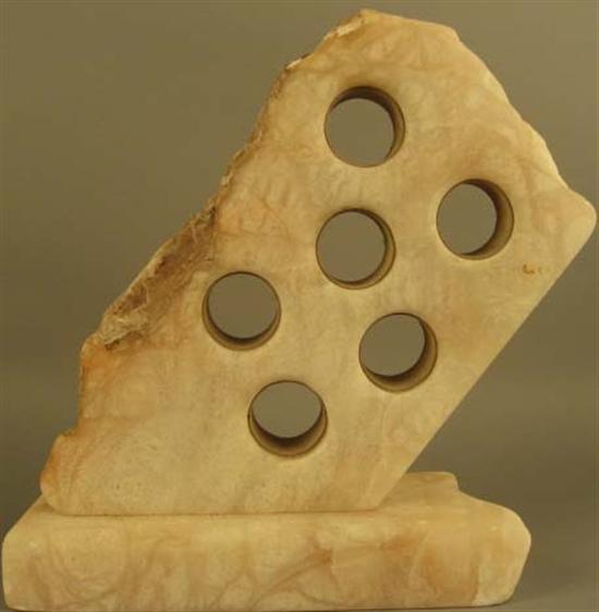 Appraisal: Stone Sculpture with six drilled holes lined in calfskin Unsigned