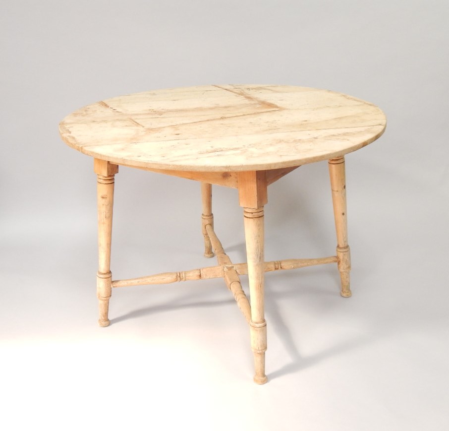 Appraisal: A Victorian circular stripped pine kitchen table upon four legs