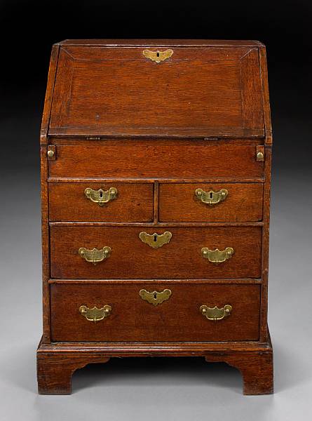 Appraisal: A diminutive George I oak slant front desk early th