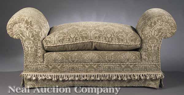 Appraisal: A Scroll Arm Upholstered Bench with rope trim cushion and