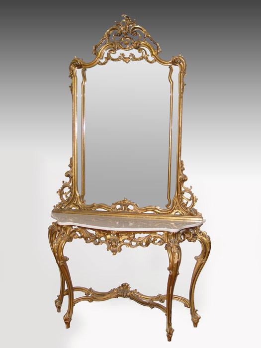 Appraisal: ROCOCO MARBLE TOP GILT HALL TABLE AND MIRROR Heavy carved