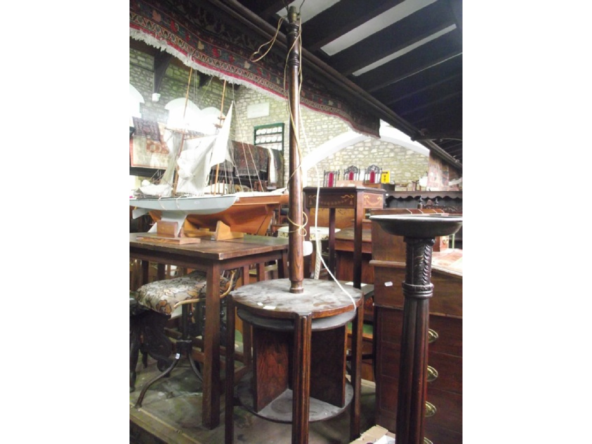 Appraisal: An early th century oak standard lamp with turned column