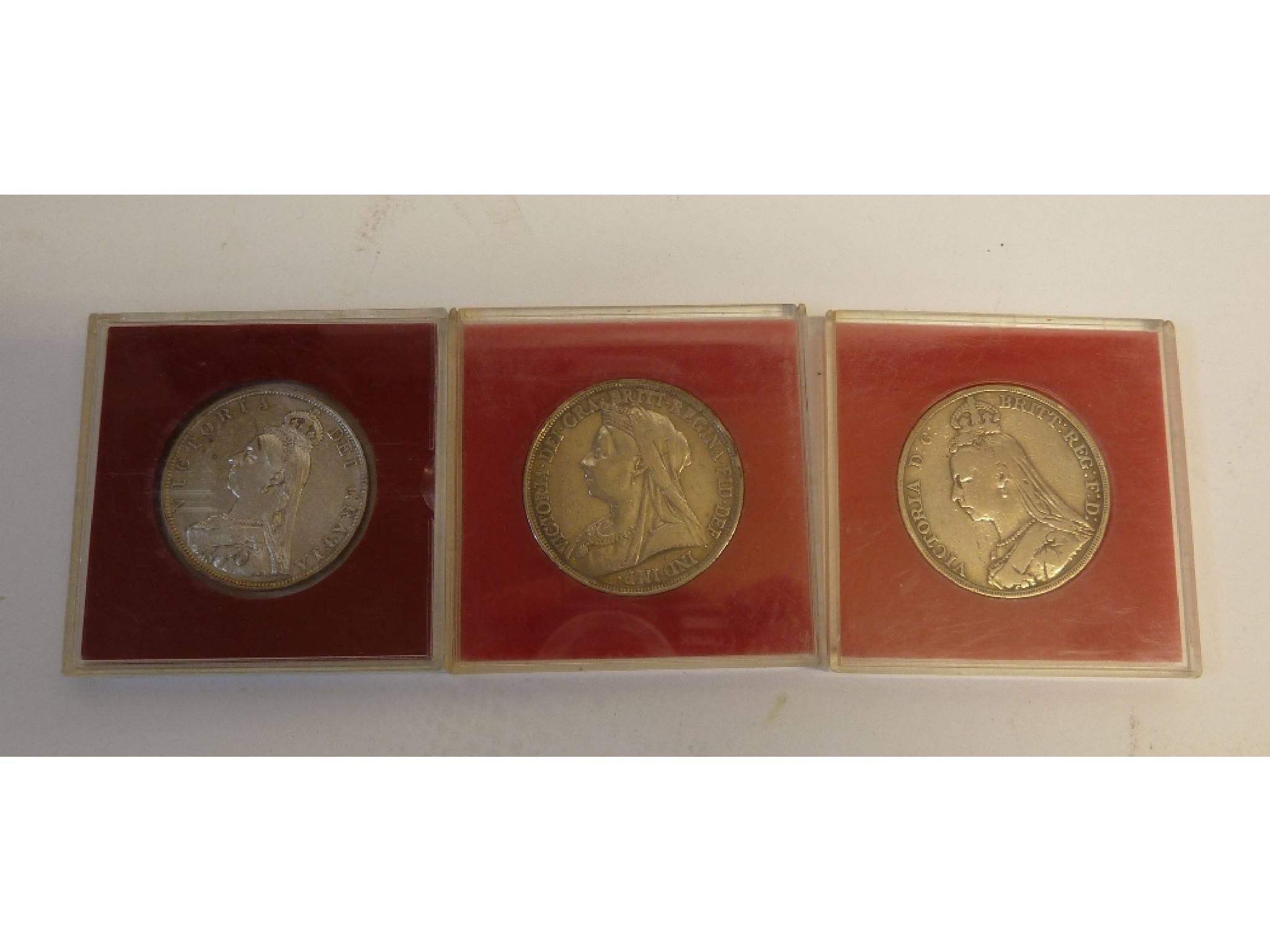 Appraisal: THREE VICTORIAN CROWN COINS and