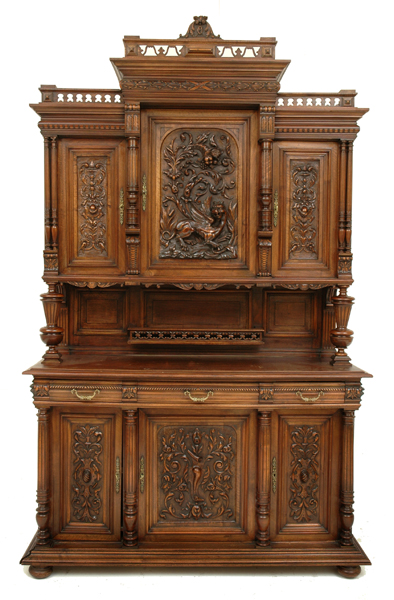 Appraisal: A FRENCH WALNUT BUFFET The molded and pierced foliate carved