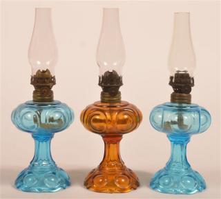 Appraisal: Pattern Antique Glass Miniature Fluid Lamps Three Matching Pattern Antique