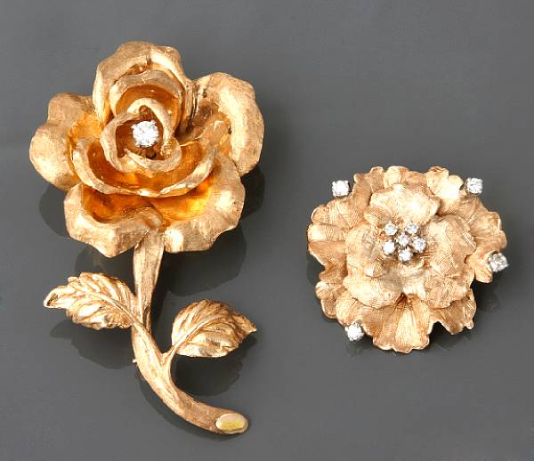 Appraisal: A collection of two diamond and k gold floral brooches