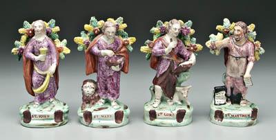 Appraisal: Four Staffordshire figures the four evangelists holding various objects related