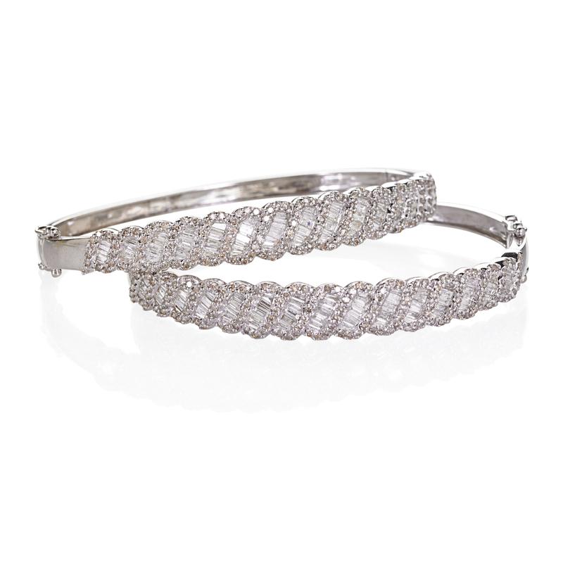 Appraisal: TWO RECENT DIAMOND K WHITE GOLD BRACELETS Hinged bangles graduated