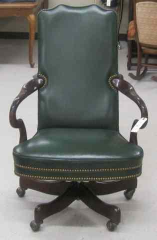 Appraisal: A MAHOGANY AND GREEN LEATHER SWIVEL DESK CHAIR Hancock Moore