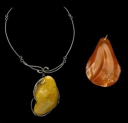 Appraisal: Two Amber Chunk Pendants one with Sterling Silver Link Necklace