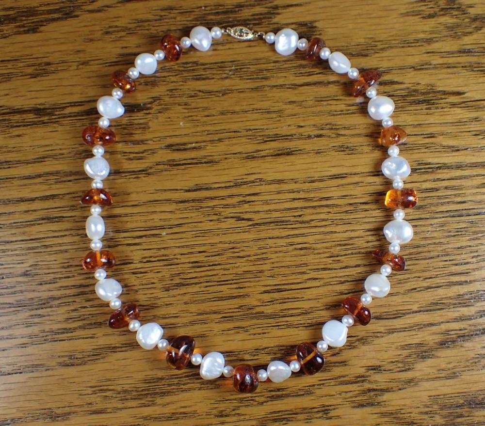 Appraisal: AMBER PEARL AND FOURTEEN KARAT GOLD NECKLACE The - strand