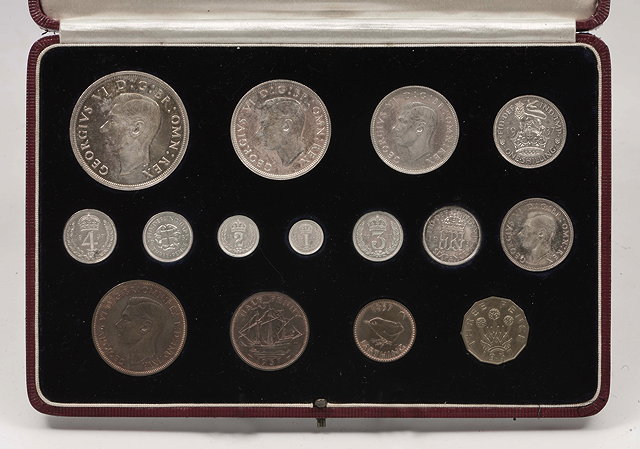 Appraisal: A CASED SPECIMEN COIN SET together with a cased coin