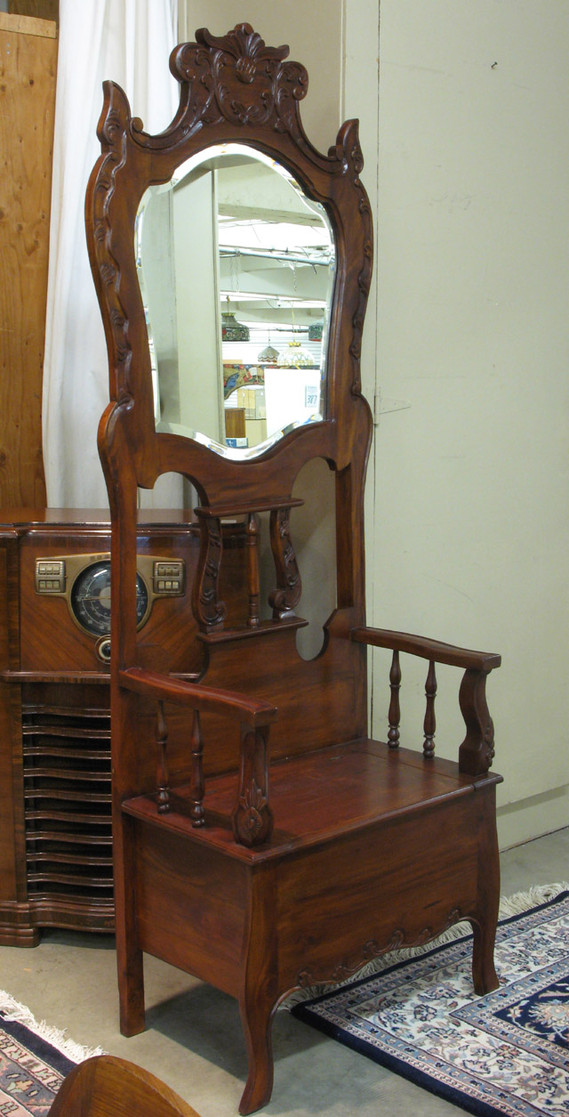 Appraisal: CARVED MAHOGANY SETTLE HALLSTAND the settle base having storage under