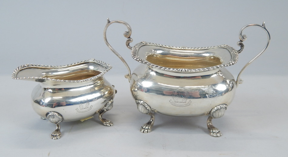 Appraisal: An Edwardian silver two handled sugar bowl on four scrolling