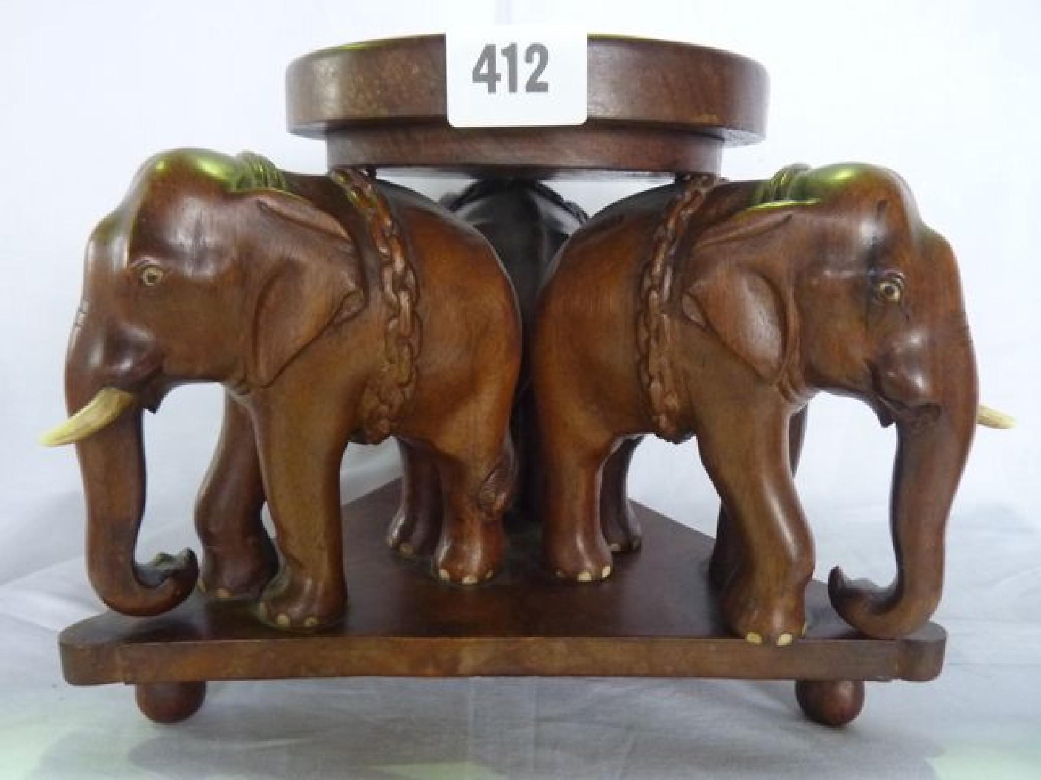 Appraisal: A late th century carved Indian hardwood stand with three