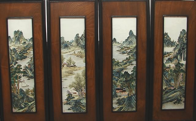 Appraisal: Hand painted vertical landscape decorated panels framed in mixed wood