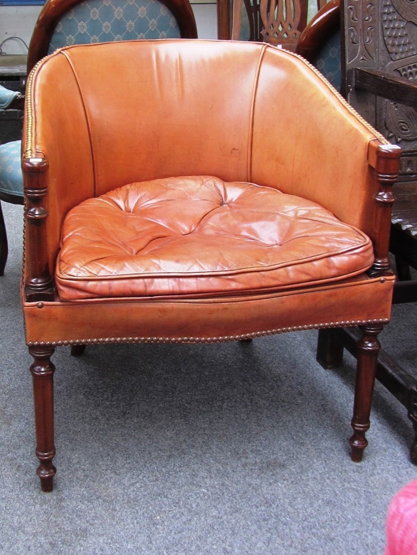 Appraisal: A th century brass studded leather upholstered mahogany framed tub