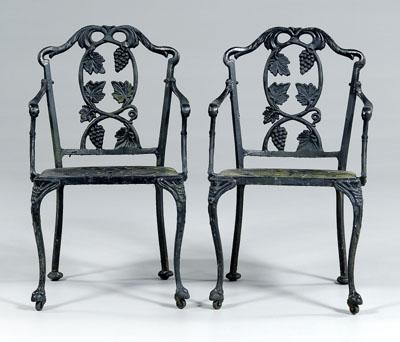 Appraisal: Pair cast iron garden armchairs each with grape decorated back