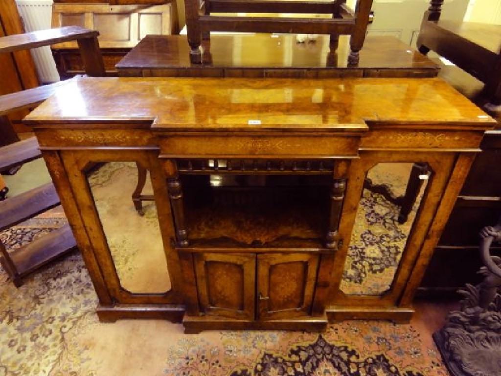 Appraisal: A Victorian figured walnut veneered breakfront side cupboard enclosed by